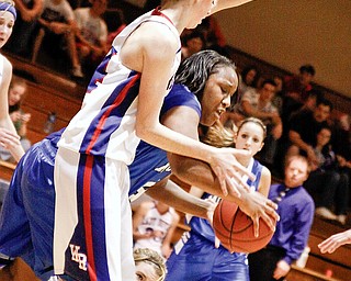 Lady Devils Victoria Brown (14) causes McDonald's Joh'Vonna Murley (44) to travel by blocking her