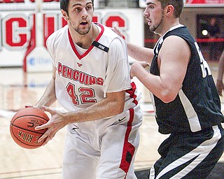 Dallas Blocker of YSU drives around Lambros Svingos of Geneva.