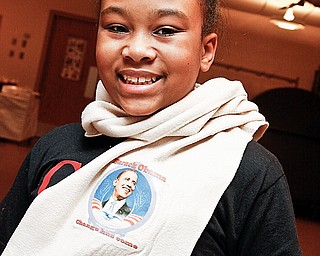 Idalis Little, 11, of Campbell, sports an Obama scarf made by Choffin Career & Technical Center students taught by Kathy Duraney for the Pre-Inauguration party at Price Memorial Church, Wednesday January 14, 2009.