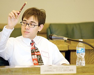 3rd Ward Councilman, Mario Leone, age 17 of Boardman raises his hand in order to speak during a mock city council meeting at the Youngstown City Council Chambers on Wednesday. High school juniors from thirty local schools participated in the event coordinated by the Youth Leadership Mahoning Valley program.