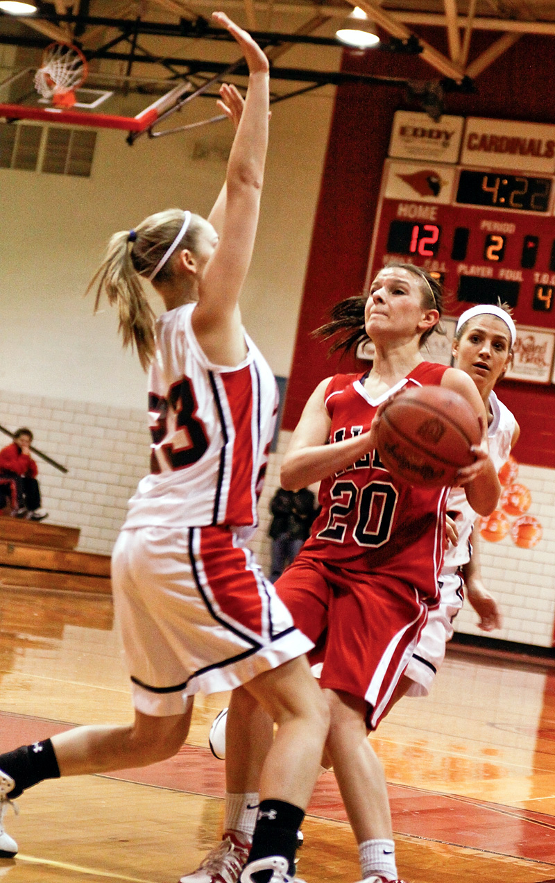 Salem Danielle Kruegel (20) gets blocked in by Canfield's Sara Shoemaker (23) and Jillian Halfhill (4) 