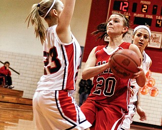 Salem Danielle Kruegel (20) gets blocked in by Canfield's Sara Shoemaker (23) and Jillian Halfhill (4)