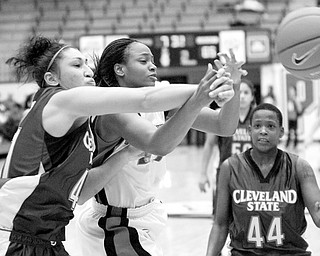 YSU's Tiara Scott (21) watches as the ball is knocked away by Cleveland State's Justine Hayes (41) after a rebound attempt during the second half of a matchup between the two teams Saturday afternoon at Beeghly Center. Cleveland State's Dominique Butler (44) is seen at right.