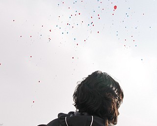 Luiz Velazquez watches as balloons he and others from Williamson Elementary released in celebration of their hopes and dreams on Barack Obama's Inguration Day, Tuesday January 20, 2009