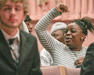 Early College student Jessica Jeter (15) of Youngstown reacts with excitement as Barack Obama is officially declared as President of the United States streamed live at YSU Kilcawley Chestnut Room, Tuesday January 20, 2009