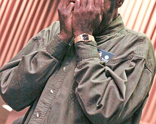 Eric Wallace of Campbell is overcome with emotion as he watched Barack Obama's Inauguration at YSU Kilcawley Chestnut Room, Tuesday January 20, 2009