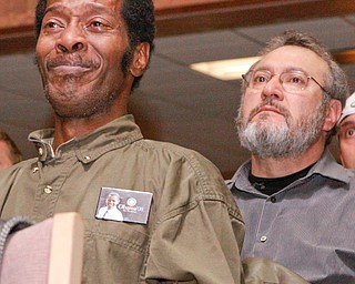 Eric Wallace of Campbell is overcome with emotion as he and Bert Ehrenberg of Boardman watch Barack Obama's Inauguration at YSU Kilcawley Chestnut Room, Tuesday January 20, 2009
