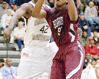 EYES ON THE BALL: Warren Harding's Chris Murray defends as Boardman's J.T. Moore receives a pass during the fourth quarter of Tuesday's game in Warren.
