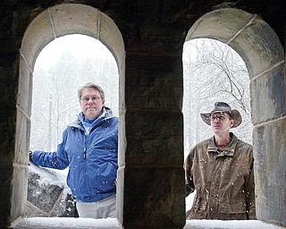 Mill Creek MetroParks’ Pioneer Pavilion, built in 1821, is undergoing a restoration project. Above, Mark Fisher, left, Mill Creek MetroParks engineer, and Steve Avery, chief landscape architect, look through stone portals on the newly restored exterior stone steps at Pioneer Pavilion.
