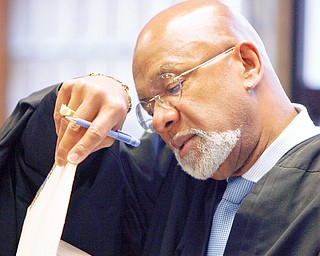 Judge Robert Douglas looks over the charges in his courtroom in Youngstown Municipal court - before sentencing Steve Croley gets sentenced on 4 counts of animal cruelty