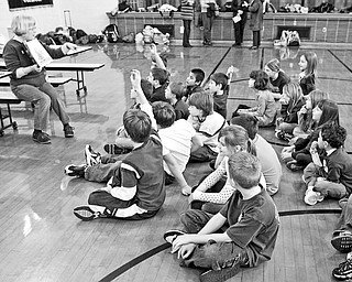 Margaret Klein - from the Boardman Library - reads to the students at the after school program - at West Boulevard Elementary
