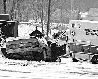 RESCUE SQUAD: The Beaver Township Rescue Squad removes Monica Hayes, 22, of Struthers from her car after a two-vehicle crash at South Avenue and Western Reserve Road. She was take to St. Elizabeth Health Center on Friday morning and was reported to have no severe injuries.
