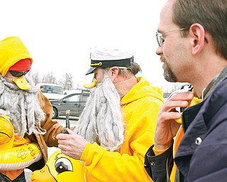 L-R Patrick Kocovsky, Carey Knight and Michael Jonas  of the Salty Quackers dove in to Mosquito Lake for Polar Bear Plunge, Saturday January 24, 2009
