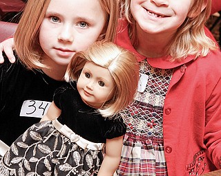 Kelley (or Sydney) Ferguson (7) and her friend Natalia Navicky (7) both of Austintown as they wait to audition for American Girl Fashion Show tryouts at St. Michael Church in Canfield, Sunday January 25, 2009