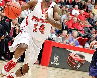 YSU Kelvin Bright (14) drives the ball to the basket at YSU Beeghly Hall against  Akron, Monday January 26, 2009