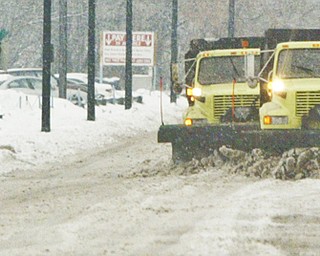 City plows run in tandem along Front St in Youngstown Wed. morning. wdlewis