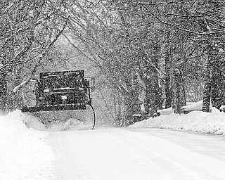 CLEANING THE STREETS - McDonald Street Dept clears away more and more snow as Old Man Winter pounded the Mahoning Valley again
