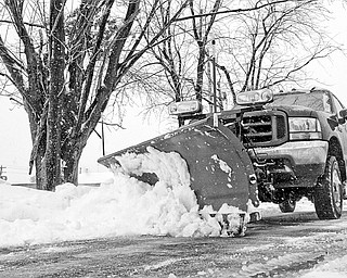 Carl Dohar plows a parking lot in Liberty 