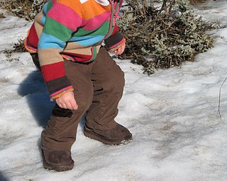 Kaitlyn, 21 months, missed northeast Ohio's snow over her Christmas visit from to grandparents Linda & Tim Kneen of Canfield.So mom and dad Erike and Matt drovethe toddler to the mountains outside Pasadena upon their return home to California so Kaitlyn could experience snow and actually use her new boots and hat!