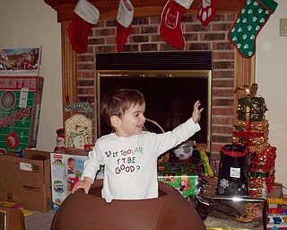 Nathaniel Richley pops out of the toy chest he received for Christmas from his grandparents, Paulette & George DiLullo.