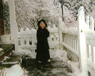 Tori DeMarco, daughter of Ron and Marsha DeMarco of Liberty. enjoys a previous white Christmas morning.