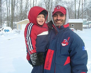 Gabriel Bettross, 23 months, and his dad Mike share a moment of winter.