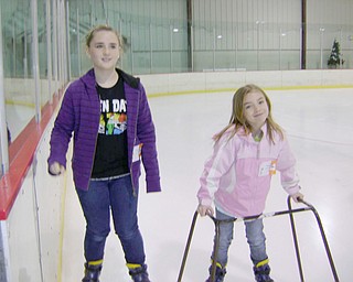 Lauren Hall, 11, and sister Emily, 7, wanted snow, but had to settle for a cool skate at the Ice Zone in Boardman when they visited relatives here over the Christmas holidays. They live in Houston, Texas.
