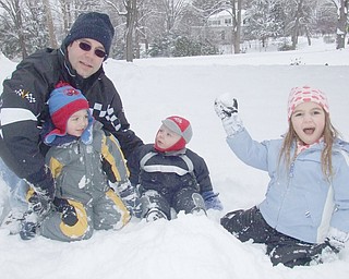 Poland residents Michael Engle and his kids, Nathan, Collin and Lauren stop for a photo taken by Mom, Tammmy Engle.