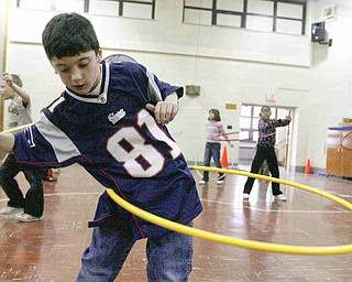 Tyler Dietz - third grader - at Stadium Drive Elementary  - participate in the hula hoop exercise - students shot baskets jumped rope and did the hula hoop for sponsors - to raise money - for the Heart Association - robertkyosay