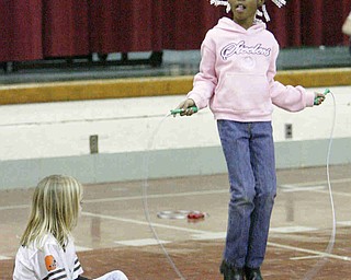 Jumpin for Heart - Kaylee Sorviolo counts how many times Lenniya Whitfield both third graders at Stadium Drive Elementary  - participate in the jump rope exercise - students shot baskets jumped rope and did the hula hoop for sponsors - to raise money - for the Heart Association - robertkyosay