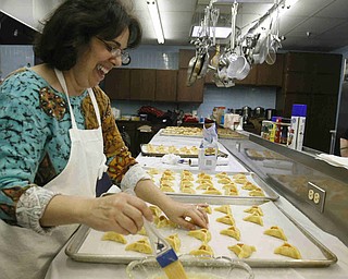 Putting on a crust is Sherri Clayman  as the church makes Hamentaschen cookies for Purim- robertkyosay