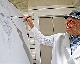 Butler artist in residence Bill Dotson works on a portrait of PResident Obama at the Butler Institute of American Art