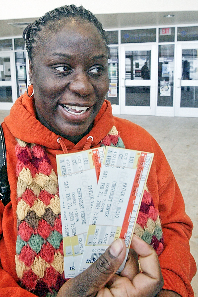 Nia Simms of Youngstown shows off tickets she purchased Wednesday at the Chevy Centre for upcoming Pavlik fight.