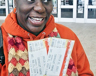 Nia Simms of Youngstown shows off tickets she purchased Wednesday at the Chevy Centre for upcoming Pavlik fight.