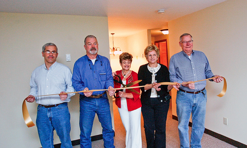 RIBBON CUTTTTING - Tom Christoff -  Ken Leonard - Bev Flowers - Jan MagLaughlin - Joe Clark - cut the ribbon at Canfield Colonial Estates. 