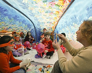IN THE BUBBLE -  Reading specialist reads to third graders in side the bubble telling them about undersea creatures and life - as Right to Read week activities got underway at Robinhood Elementary in Boardman - 