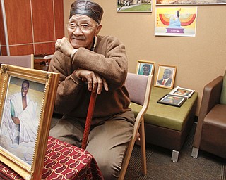 Youngstown artist Joseph Thomas with his artwork at YSU's African Marketplace for Black History Month in the Chestnut room at Kilcawley Center, Saturday February 7, 2009