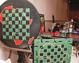 Professor Peacock (49) of Columbus stated that in chess "white moves first -so its subliminally racist." Playing chess has been proven to improve test scores, so he crafts chess board tables and pieces to encourage youth to learn strategies instead of participating in gangs. YSU's African Marketplace for Black History Month in the Chestnut room at Kilcawley Center, Saturday February 7, 2009 ** If you also want to diminish youth violence, You may contact him at testscorerise@yahoo.com