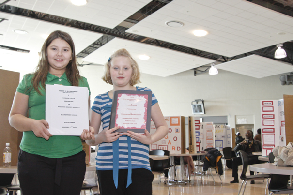 McGuffey 5th Graders Tabatha West (11) and Kaitlyn Geisel (11) displayed her project at the Youngstown City Schools All-City Science Fair at East High School, Saturday February 7, 2009