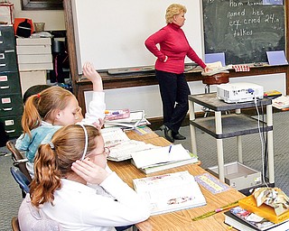 Third graders of Mary Mounce at Youngstown Christian School work on a reading program