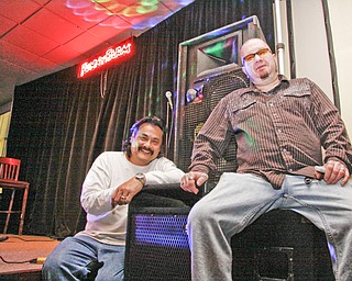 Funny Farm Comedy Club Entertainment Director Eric Stevens and Proprietor Chris Jackson next to the stage