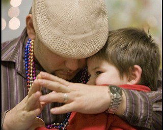 2.24.2009
Miguel Cuevas and his son Jayden, 3, both residents of Lowelville, pray during a Mardi Gras celebration at Faith Community Church on Midlothian Ave in Youngstown, Ohio Feb. 24, 2009.
Geoffrey Hauschild
