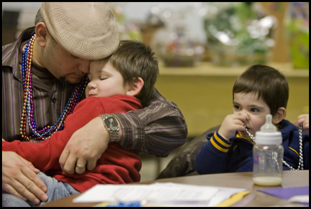 2.24.2009
Miguel Cuevas and his son Jayden, 3, both residents of Lowelville, pray, while Rocco, 1, explores the possibilities of what beads can be used for during a Mardi Gras celebration at Faith Community Church on Midlothian Ave in Youngstown, Ohio Feb. 24, 2009.
Geoffrey Hauschild