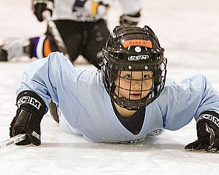 Robert Lachman, age 7 of Lake Milton, falls to the ice during a drill of red light green light at the Ice Zone in Boardman Monday afternoon. Approximately, 50 area youth attended a Learn to Skate Program hosted by the Mahoning Valley Phantoms where the first 30 participants received free jerseys and equipment donated by Pittsburgh Penguin Sidney Crosby.