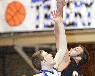 McDonald's Tom Orr and Springfield's Todd Kibby go for the tip off at McDonald.