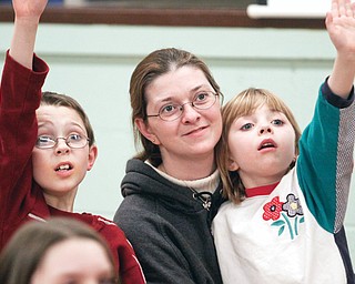 Bradley (9) May with his mother Cheryl and his sister Sarah (6) at Lake Milton Raptor Education Center's presentation of Birds of Prey at First Presbyterian Church in Columbiana, Wednesday February 25, 2009
