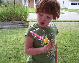 HER EYES ARE SMILIN’: Henry Panfil of Youngstown says his granddaughter, Abigail Shay, is as Irish as you can get.