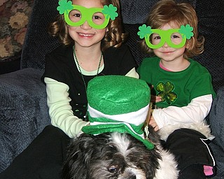 PUPPY LOVE: Madison and Alivia Horvath are shown with their cousin’s puppy, Max. The girls are the daughters of Rick and Kelley Horvath of New Middletown.