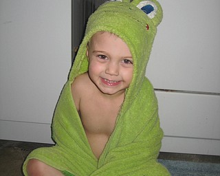 BATHTIME FUN: This is Keaton Mayhew drying off with his froggy green towel. Photo was submitted by Charisse Mayhew, his mom.