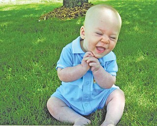 HAPPY FELLA: Aidan Barnot, the 1-year-old son of Ryan and Erin Barnot of Cortland, loves the outdoors and can’t wait for spring to return. His mom took the picture in his yard — when the weather was friendlier.